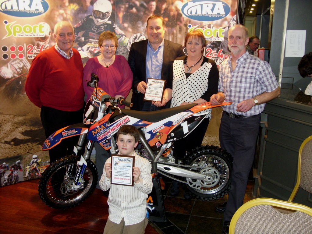 Club President, Junior Burrows with (L to R) Liz Patterson, Michael Taylor (M.S.T. Transport) Alison Taylor, Arthur McMullan; (front) Adam McMullan... Receiving awards for special recognition for their support at the clubs annual Charity Grasstrack